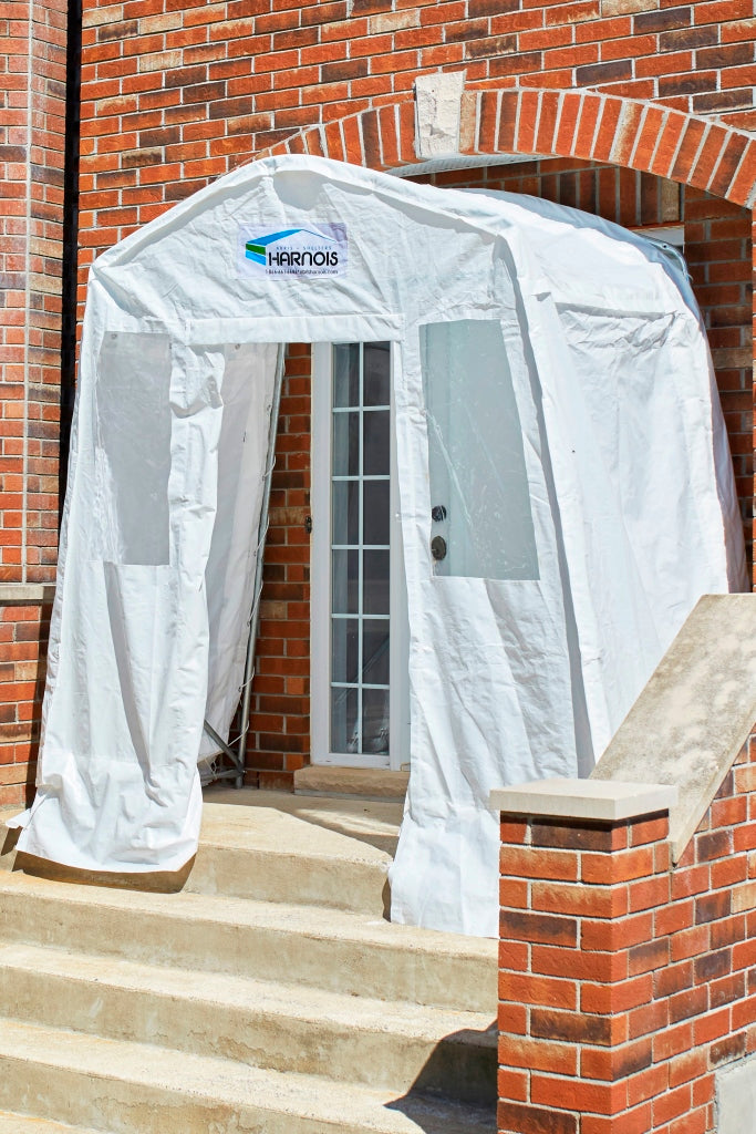 Harnois vestibule installed in a brick entrance to protect the door from snow