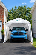 Harnois PLUS 12 car shelter installed in a driveway with a pickup truck inside